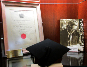 Museum display at the Wade Center featuring Charles Williams's honorary Masters of Arts degree from Oxford University, and the mortar board he wore during the ceremony.